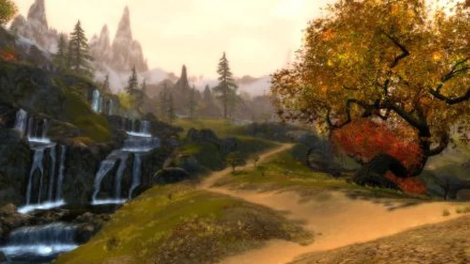 Grothmar Wardowns landscape with waterfalls rocky hills autumn trees and distant mountain peaks.