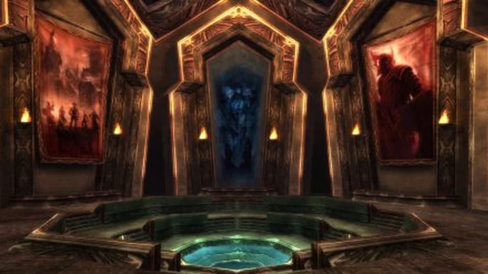 Hall of Monuments interior with glowing orange walls large banners and a central circular platform.